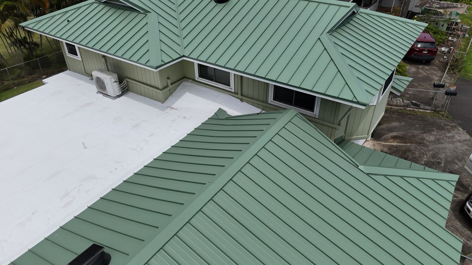 Green Metal Roof Installation at Residential Property image